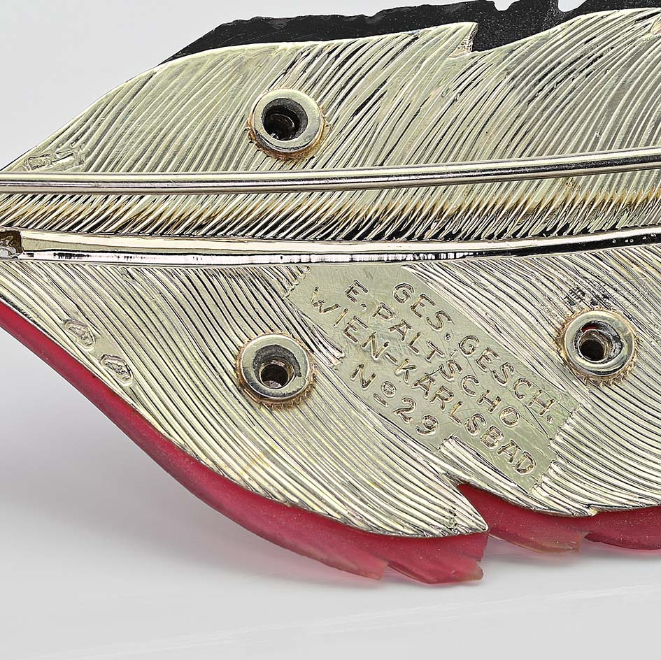 Art Deco Paltscho Vienna Red Chalcedony Black Onyx and Diamond Feather Brooch, carved red chalcedony and black onyx feather with diamond dots and rose-cut diamonds along the stem in 14ct white gold. Circa 1920. With Austro Hungarian marks of the period - Signed Ges. Gesh. (copyright) E. PALTSCHO – WIEN – KARLSBAD N. 29