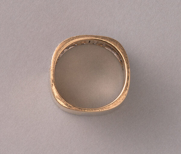 Vintage Diamond and Bi Colour 18ct Gold Band Ring; 18ct yellow and white gold juxtaposed angle pavé set with 48 brilliant cut diamonds, 2.50 carat total, by the Swiss master jeweller Paul Binder. Circa 1970s, Zurich, Switzerland