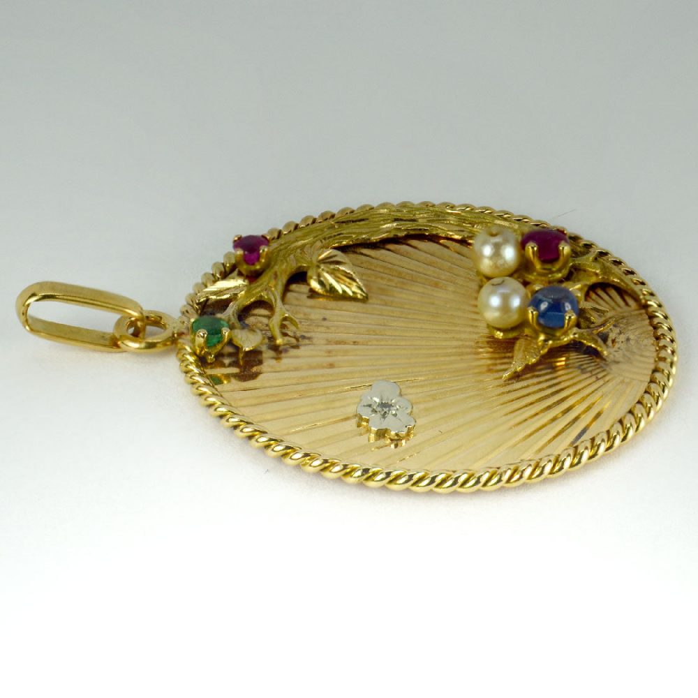 French Multi Gemstone and 18ct Yellow Gold Lovebirds Pendant; 18ct yellow gold pendant depicting a pair of lovebirds on a branch in front of the setting sun, set with emeralds, rubies, sapphires, diamond and pearls