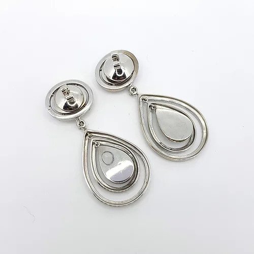 Diamond Pear Shaped Cluster Halo Drop Earrings; diamond encrusted pear-shaped drop surrounded by two diamond-set halos, suspended from an oval fixed-halo diamond cluster stud, 6.00 carat total, in 18ct white gold