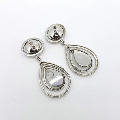 Diamond Pear Shaped Cluster Halo Drop Earrings; diamond encrusted pear-shaped drop surrounded by two diamond-set halos, suspended from an oval fixed-halo diamond cluster stud, 6.00 carat total, in 18ct white gold