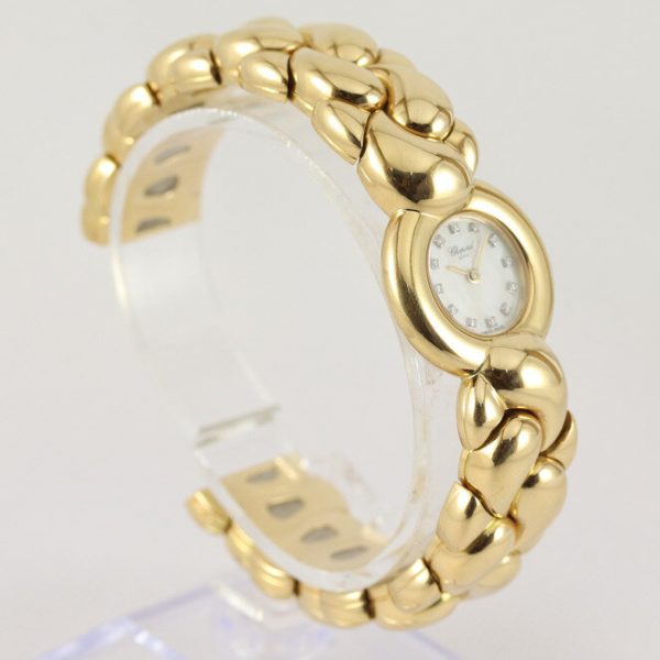Chopard Casmir Ladies 18ct Yellow Gold Bangle Watch; with Mother of Pearl dial featuring factory set diamond hour markers, protected by sapphire crystal, Quartz movement, with Chopard box