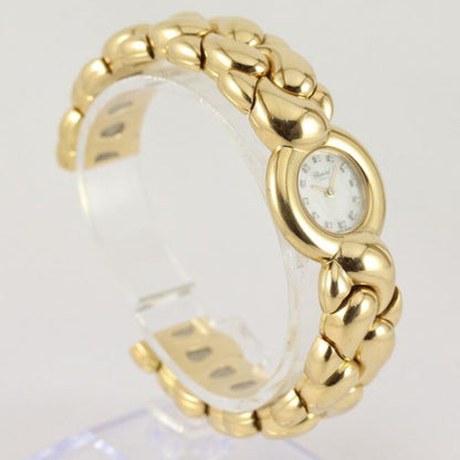 Chopard Casmir Ladies 18ct Yellow Gold Bangle Watch; with Mother of Pearl dial featuring factory set diamond hour markers, protected by sapphire crystal, Quartz movement, with Chopard box