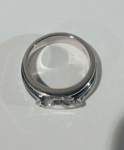 Vintage Marquise Diamond and Sapphire Band Ring; set with a 1.25ct marquise cut diamond with square cut sapphire shoulders, in platinum, Circa 1980s