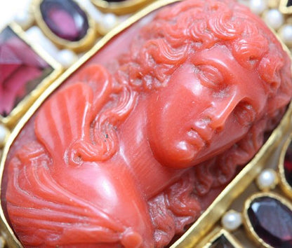 Neo Renaissance Style Pearl and Garnet set Cameo Brooch; 19thC cameo surrounded by later small pearls and garnets, 18ct gold, Circa 1980.