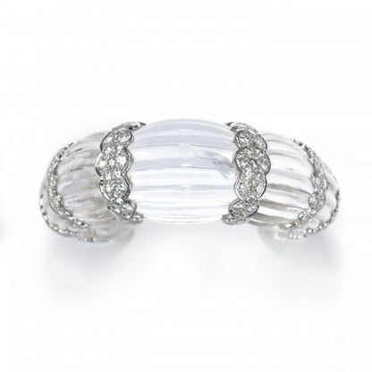 Rock Crystal and Diamond Cuff Bangle Bracelet; modern fluted rock crystal bangle bracelet carved from one single piece of rock crystal, with eight scalloped 18ct white gold sections set with 7.00 carats round brilliant-cut diamonds