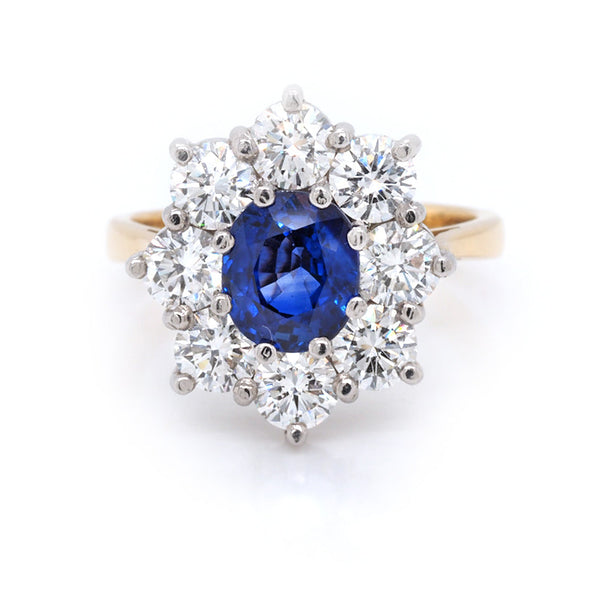 Sapphire and diamond cluster ring in gold.
