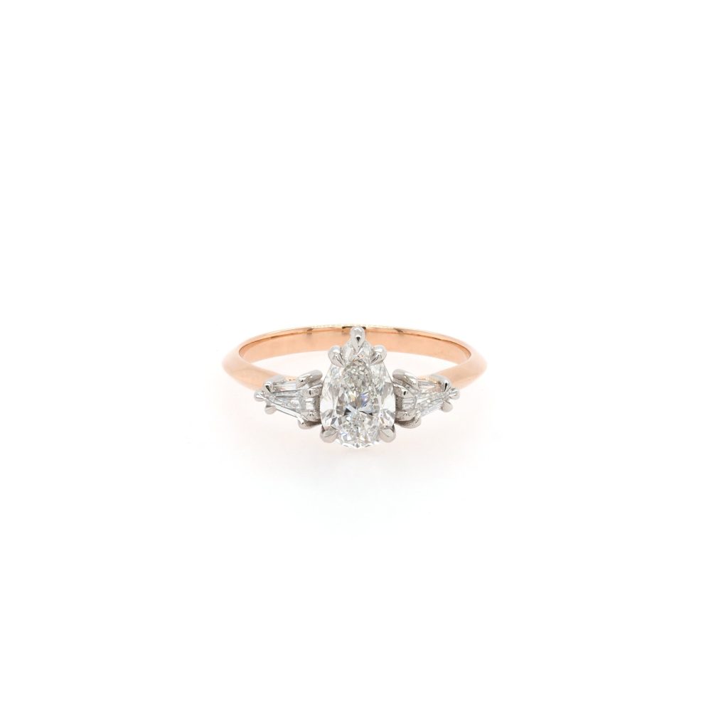 Diamond three stone ring in rose gold.