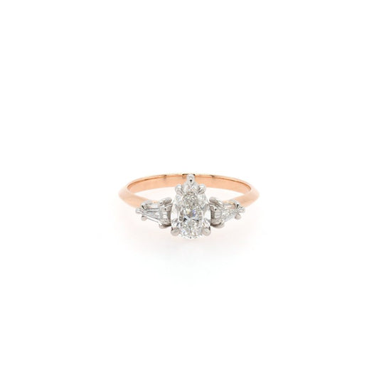 Diamond three stone ring in rose gold.