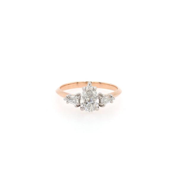 Diamond three stone ring in rose gold.