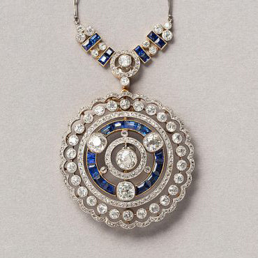 Art Deco Old Cut Diamond and Sapphire Pendant Brooch, set with 5.25 carats of old-cut and rose-cut diamonds accented with tapered baguette-cut sapphires in platinum upon 18ct yellow gold. Circa 1915-1920