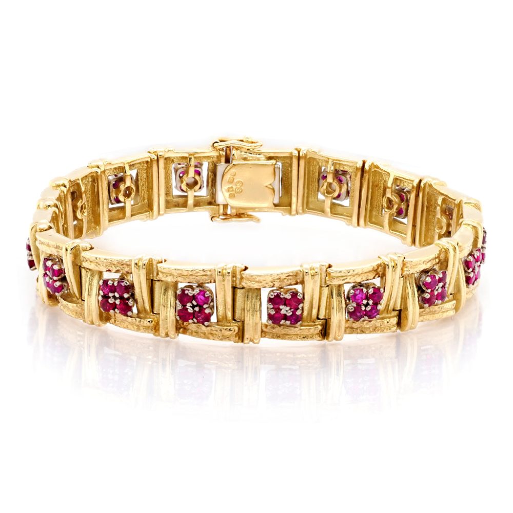 Gold bracelet set with rubies.