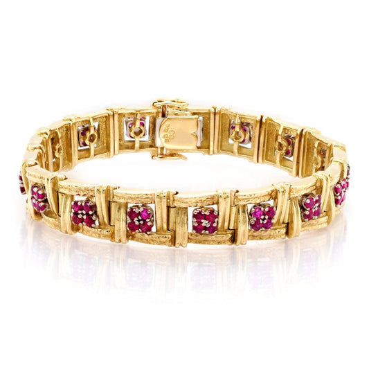 Gold bracelet set with rubies.