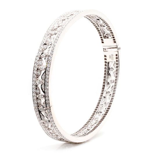 Diamond hinged bangle in white gold.