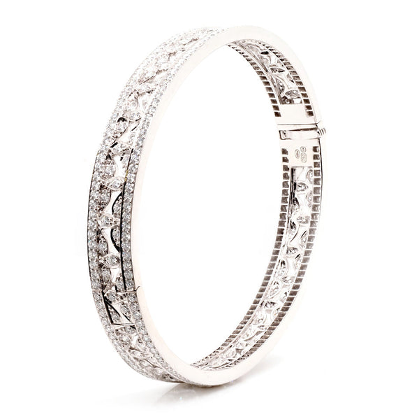 Diamond hinged bangle in white gold.