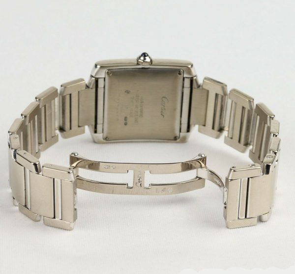 Cartier Gents Tank Française 18ct White Gold 28mm Automatic Rectangular Watch, silver guilloche dial, black Roman numerals, date aperture at 6, sapphire crystal glass, cabochon blue gem set crown, on Cartier 18ct bracelet with hidden double deployment clasp. With Cartier booklet and certificate dated 2006.