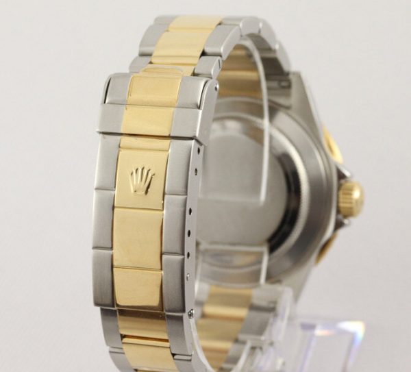 Rolex Submariner Date 16613 Serti Dial Steel and Gold Automatic 40mm Wristwatch Slate Serti factory dial - 8 diamond and 4 sapphire hour markers, steel and gold Oyster bracelet with fold-over clasp, with gold through the buckle, with Box and Papers