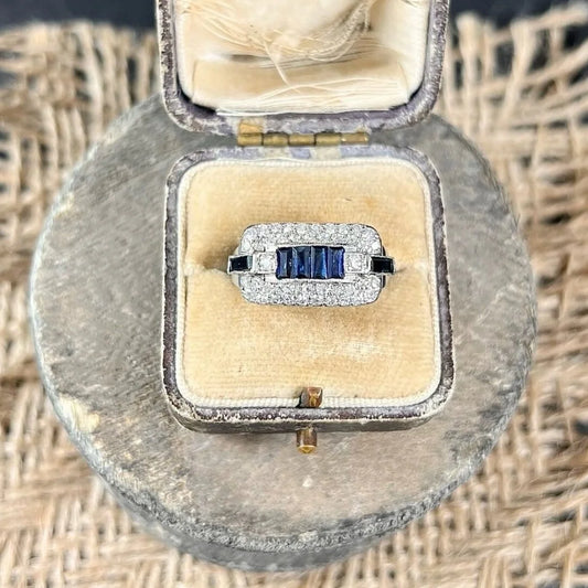 A sapphire and diamond cocktail ring in platinum, in an antique ring box