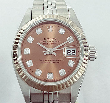 Rolex Lady Datejust 79174 with Original Diamond Set Copper Dial; 26mm stainless steel case with white gold bezel features a rare copper dial with original factory set diamond hour markers, magnified date, screw-locked crown, sapphire crystal, automatic, self-winding movement, on a stainless steel Jubilee bracelet. Circa 2002. Comes with Rolex box and papers.