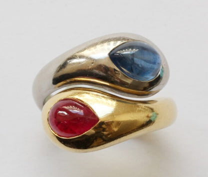 Vintage 18ct Gold Snake Ring set with Sapphire and Ruby; bi-colour 18ct gold snake ring, set with pear-shaped drop cabochon cut 2.74ct sapphire and 1.50ct ruby, By Hemmerle. Munich, circa 1980, with its original pouch and invoice.