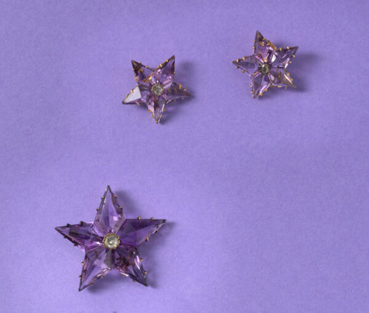 Antique Victorian Amethyst and Diamond Star Pendant/Brooch and Earrings Suite; set with high kite shaped amethysts and a rose cut diamond in the centre.