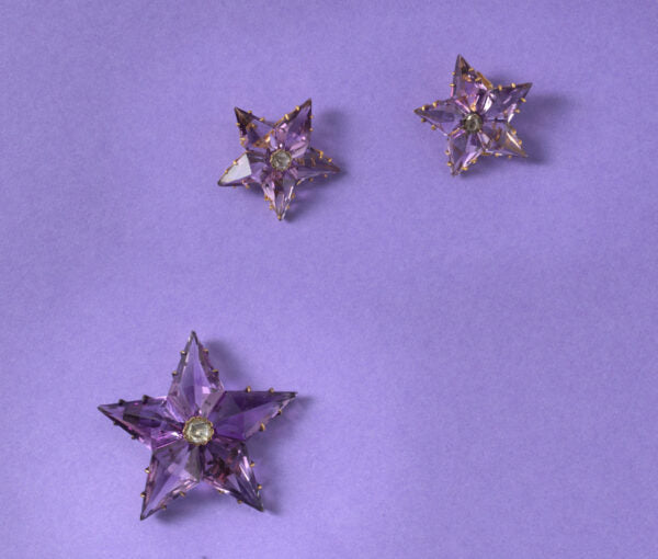 Antique Victorian Amethyst and Diamond Star Pendant/Brooch and Earrings Suite; set with high kite shaped amethysts and a rose cut diamond in the centre.