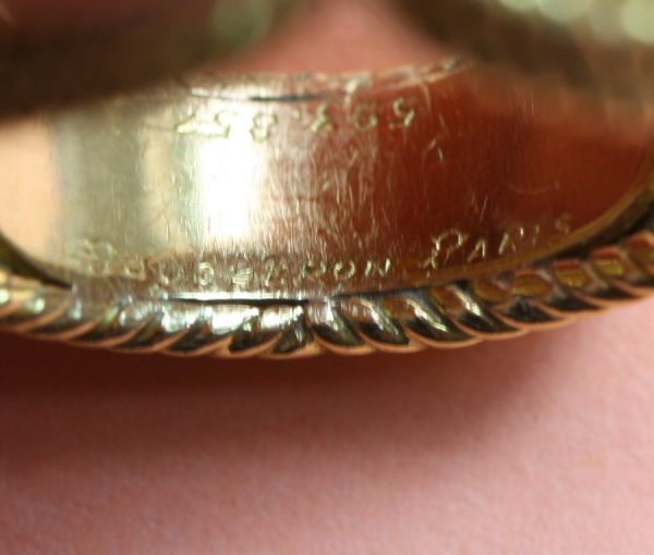 Boucheron Vintage Orange Garnet and 18ct Yellow Gold Cocktail Ring; 18ct gold rope twist ring set with 2ct brilliant cut orange garnet. Signed and numbered, Circa 1960