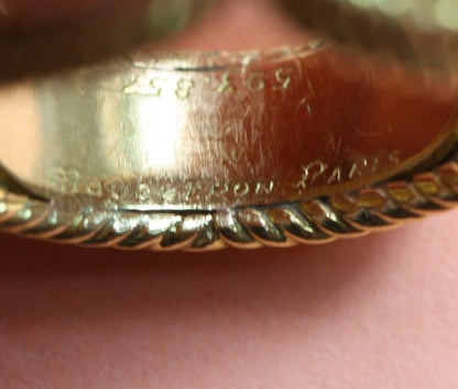 Boucheron Vintage Orange Garnet and 18ct Yellow Gold Cocktail Ring; 18ct gold rope twist ring set with 2ct brilliant cut orange garnet. Signed and numbered, Circa 1960