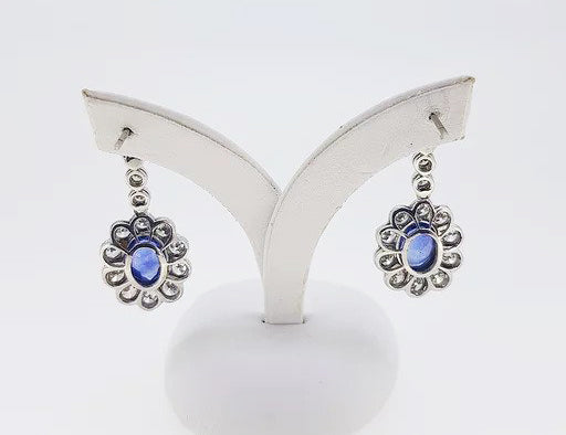 Sapphire and Diamond Oval Floral Cluster Drop Earrings; 2.50cts oval sapphires surrounded by 2.76cts diamonds, diamond set drops, 18ct gold