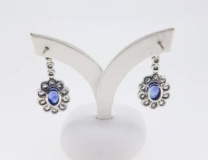 Sapphire and Diamond Oval Floral Cluster Drop Earrings; 2.50cts oval sapphires surrounded by 2.76cts diamonds, diamond set drops, 18ct gold