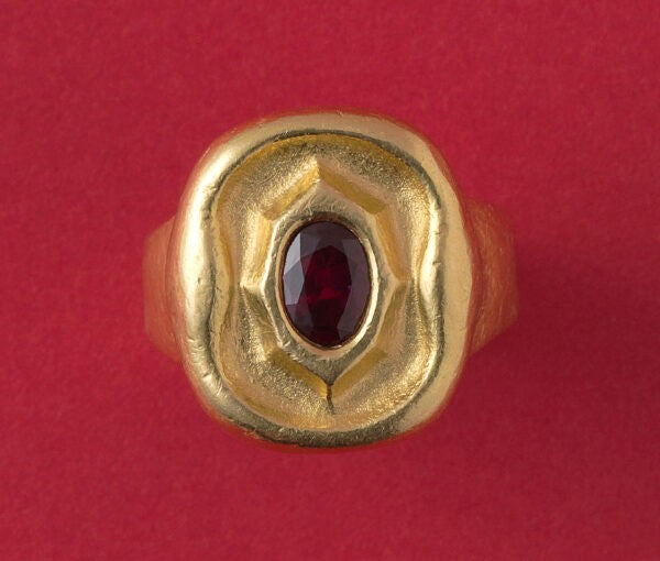 Art Deco Hammered Gold Ring with Ruby; hammered gold anthroposophical ring set with a 1.40ct oval natural untreated bright red Cambodian ruby, from the Steiner workshops during Karl Mohr’s supervision
