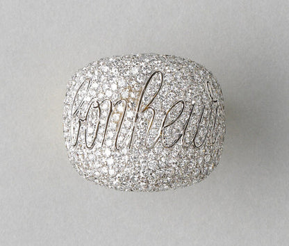 Diamond Bonheur Bombe Dress Ring; set with 4cts brilliant cut diamonds in which is graceful cursive lettering the word Bonheur, echoed inside the band in 18ct yellow gold