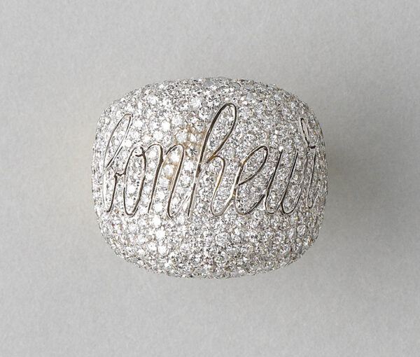 Diamond Bonheur Bombe Dress Ring; set with 4cts brilliant cut diamonds in which is graceful cursive lettering the word Bonheur, echoed inside the band in 18ct yellow gold