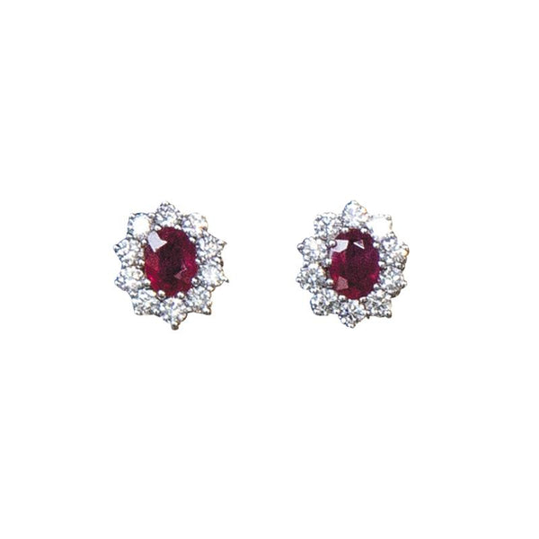 Ruby and diamond cluster earrings in gold.