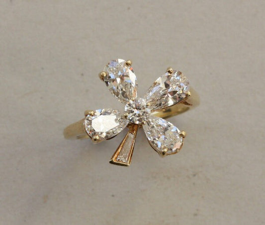 Vintage 1.62ct Diamond Four Leaf Clover Dress Ring; central brilliant cut diamond surrounded by four pear shaped diamonds, baguette-cut diamond set stem