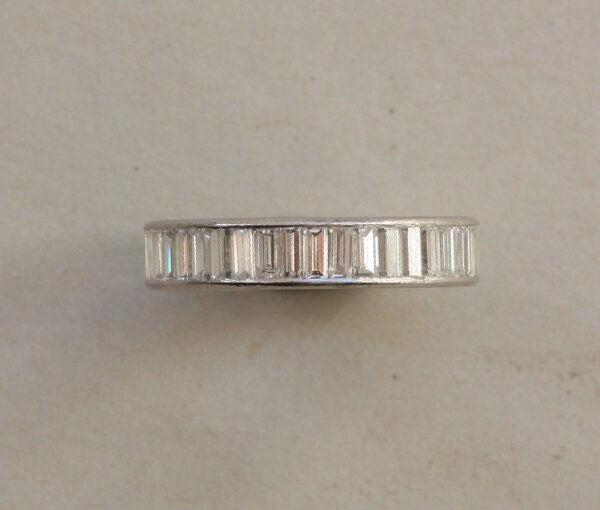 Vintage 3.08 carat Baguette Cut Diamond and Platinum Full Eternity Band Ring; set with baguette-cut diamonds, vertically set, Circa 1950, Numbered: CJ 551.