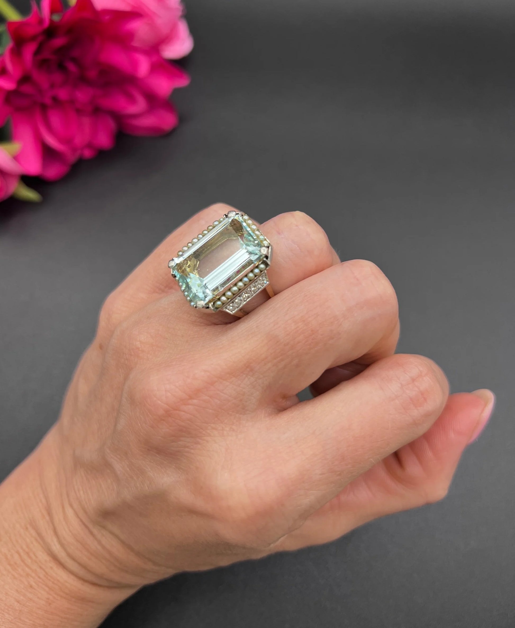 An aquamarine, pearl and diamond large cocktail ring in yellow gold and platinum, modelled on a hand