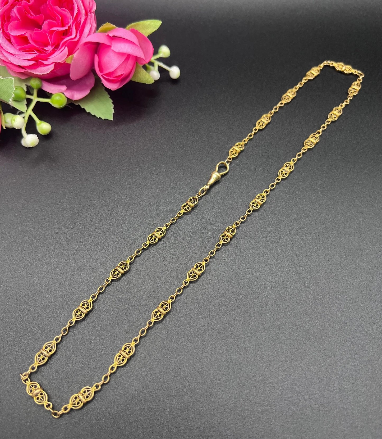 A yellow gold fancy link chain necklace