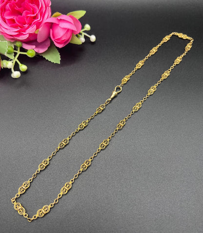 A yellow gold fancy link chain necklace