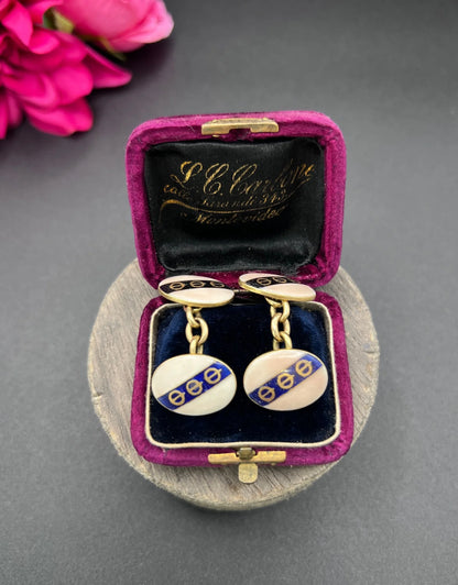 A pair of yellow gold enamel striped cufflinks with chain link fittings, in an antique box