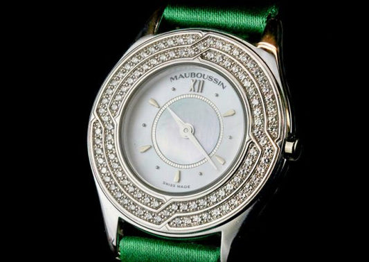 Mauboussin Ladies 18ct Gold and Diamond 26mm Quartz Watch, 18ct gold case, 1.00ct diamond bezel, on a green Mauboussin fabric strap.