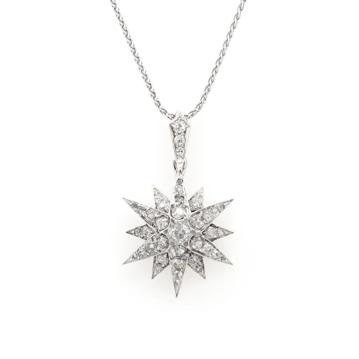 Victorian silver and gold diamond star pendant on a white gold chain.