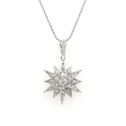 Victorian silver and gold diamond star pendant on a white gold chain.