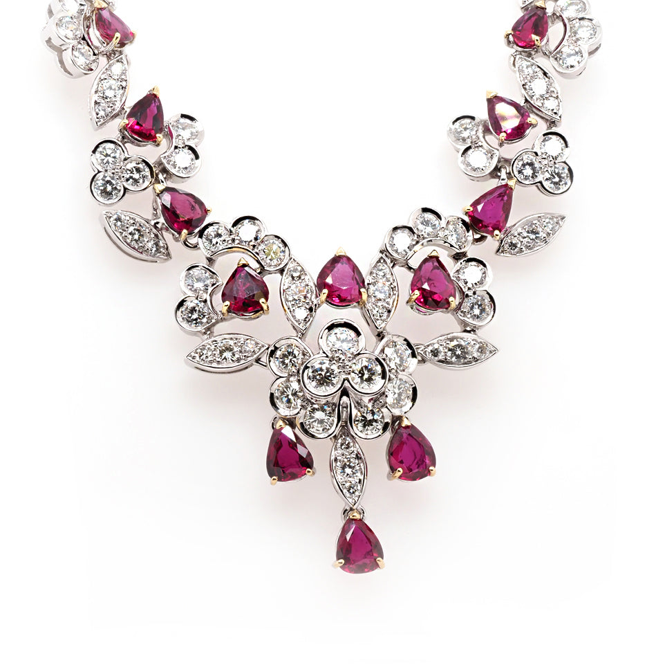 Diamond and ruby ornate necklace in white gold.