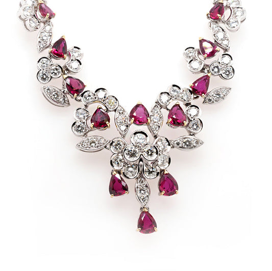 Diamond and ruby ornate necklace in white gold.