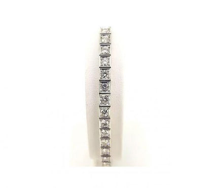 Vintage Ornately Engraved Diamond Line Bracelet, 4.50 carats, brilliant cut diamonds, four-claw set in square mounts with engraved sides, 18ct white gold