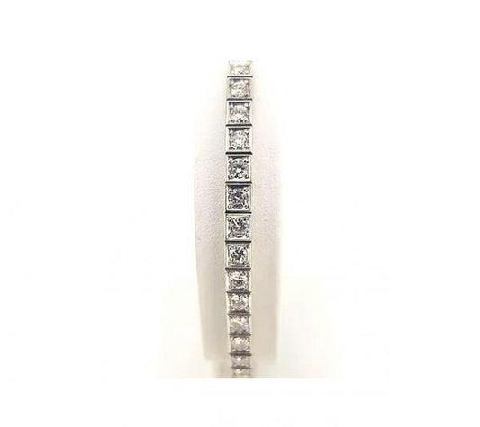 Vintage Ornately Engraved Diamond Line Bracelet, 4.50 carats, brilliant cut diamonds, four-claw set in square mounts with engraved sides, 18ct white gold