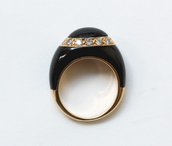 Van Cleef and Arpels Onyx, Diamond and 18ct Yellow Gold Fidji Ring; Signed and numbered Van Cleef & Arpels, Model Fidji, 0.51 carat total.