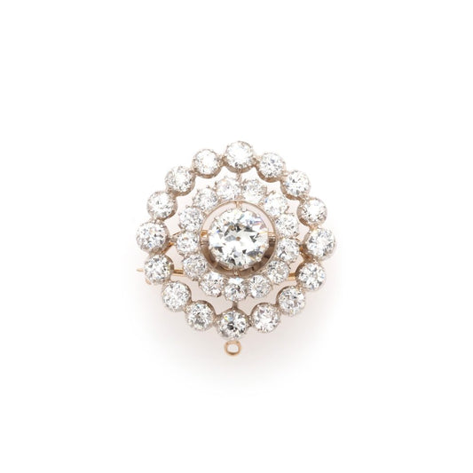 Diamond target brooch in yellow gold.