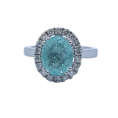 Paraiba Tourmaline and Diamond Cluster Ring in 18ct White Gold; 3.73 carat oval faceted aqua/greenish-blue Paribia tourmaline surrounded by diamonds